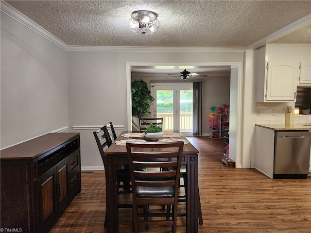 6905 Harlow Dr, Archdale, NC 27263 - dining space with a textured ceiling, wood finished floors, a ceiling fan, crown molding, and baseboards