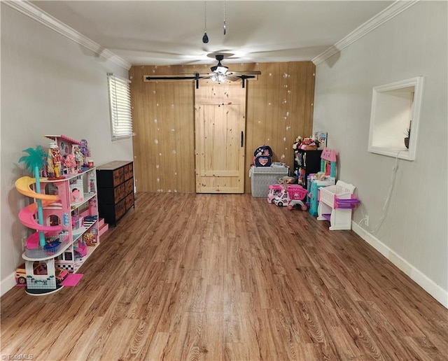 6905 Harlow Dr, Archdale, NC 27263 - rec room with ornamental molding, wood finished floors, baseboards, and ceiling fan
