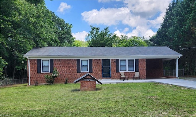 6905 Harlow Dr, Archdale, NC 27263 - ranch-style home with brick siding, a carport, and driveway