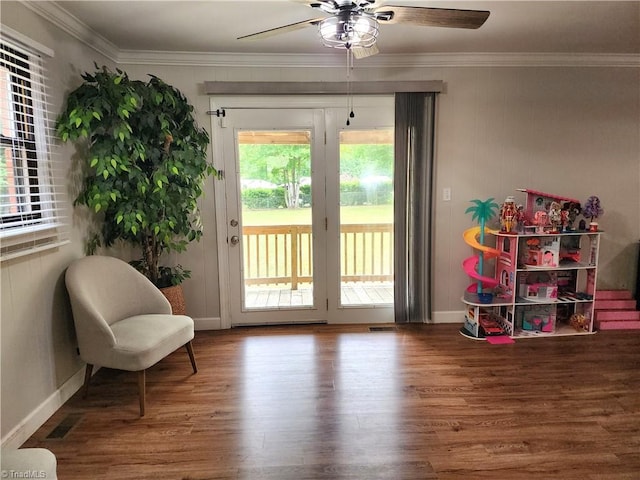 6905 Harlow Dr, Archdale, NC 27263 - living area featuring crown molding, ceiling fan, wood finished floors, and baseboards