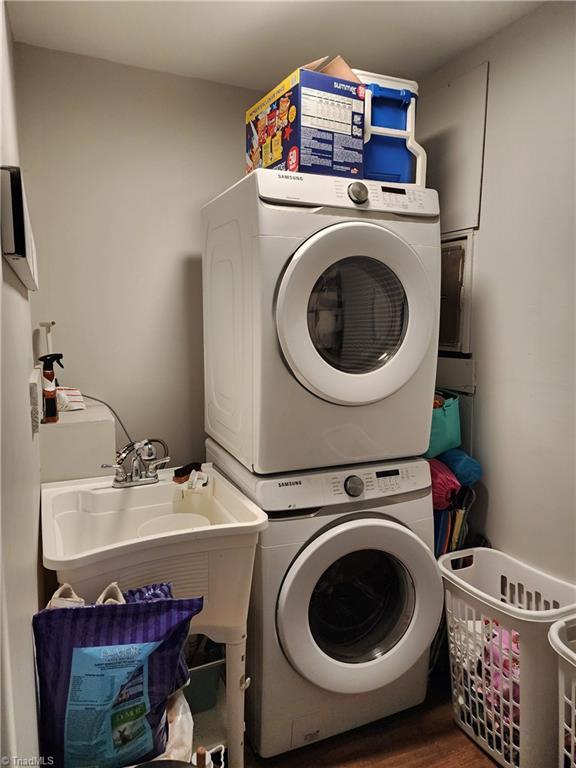 6905 Harlow Dr, Archdale, NC 27263 - washroom featuring stacked washing machine and dryer