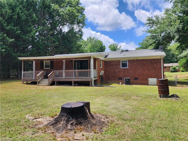 6905 Harlow Dr, Archdale, NC 27263 - back of house featuring cooling unit, crawl space, brick siding, and a deck