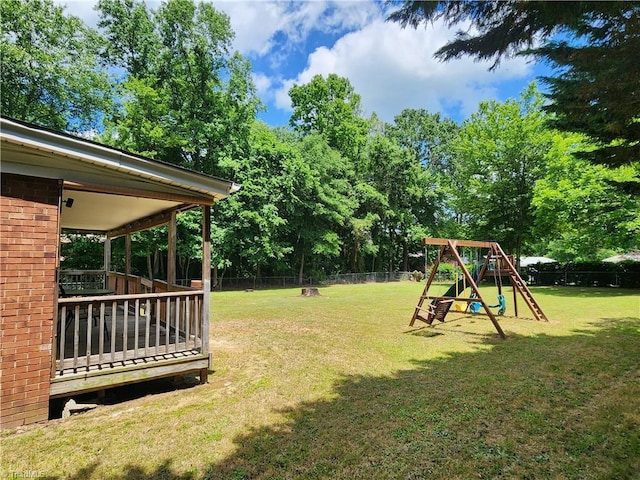6905 Harlow Dr, Archdale, NC 27263 - view of yard featuring a playground and view of wooded area