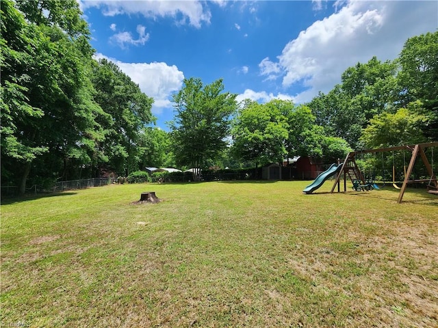 6905 Harlow Dr, Archdale, NC 27263 - view of yard featuring a playground and view of wooded area