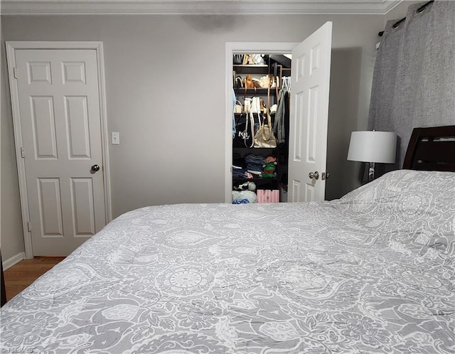 6905 Harlow Dr, Archdale, NC 27263 - bedroom featuring crown molding, a closet, and wood finished floors