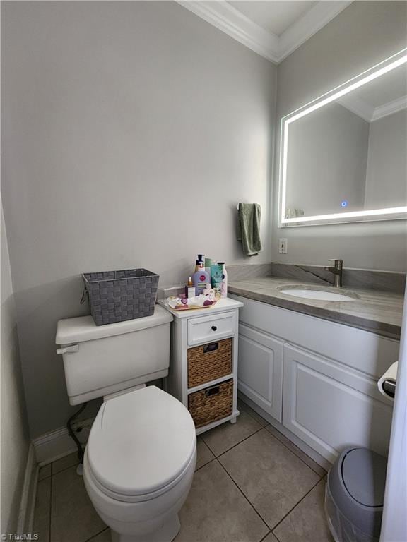 6905 Harlow Dr, Archdale, NC 27263 - bathroom featuring ornamental molding, toilet, vanity, and tile patterned flooring