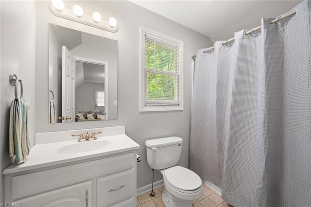 bathroom with vanity, toilet, baseboards, a shower with shower curtain, and tile patterned floors