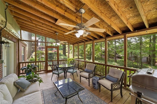 sunroom with a ceiling fan, outdoor dining area, and outdoor lounge area
