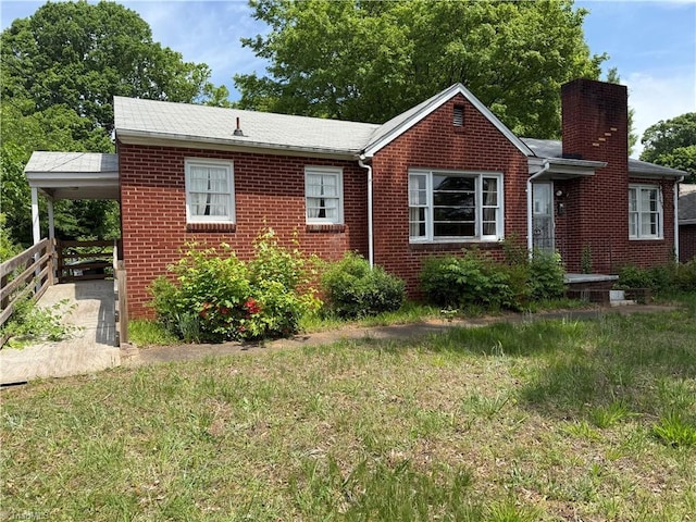 1607 Princeton St, Winston-Salem, NC 27103 - view of front of house with a chimney, brick siding, and a front yard