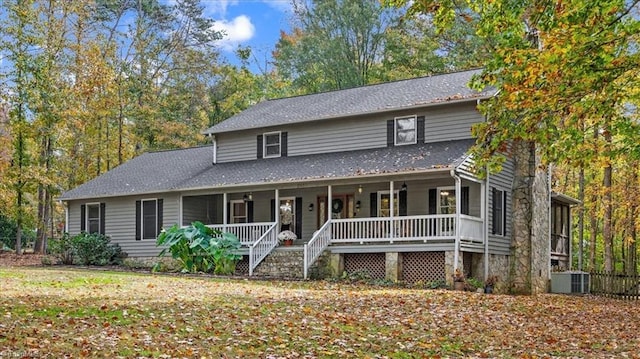 view of front facade featuring covered porch and central AC