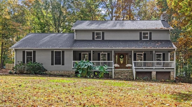 view of front property featuring a front lawn and a porch