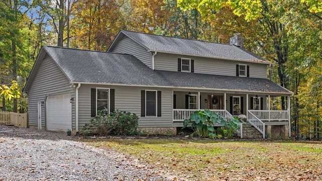 view of front of house with covered porch and a garage