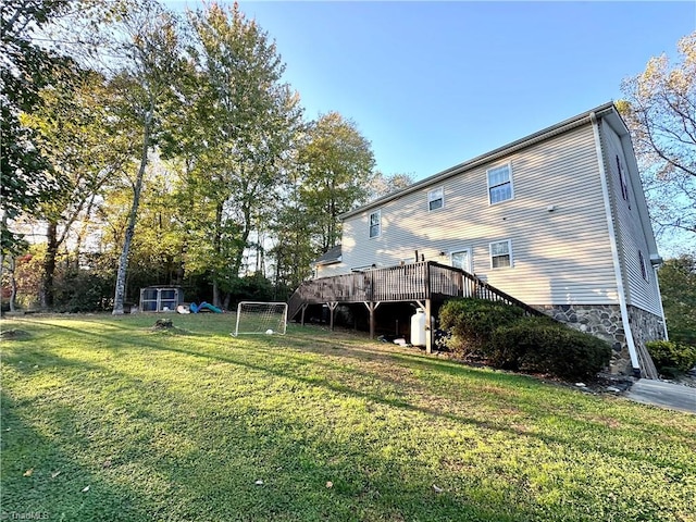 view of yard with a wooden deck