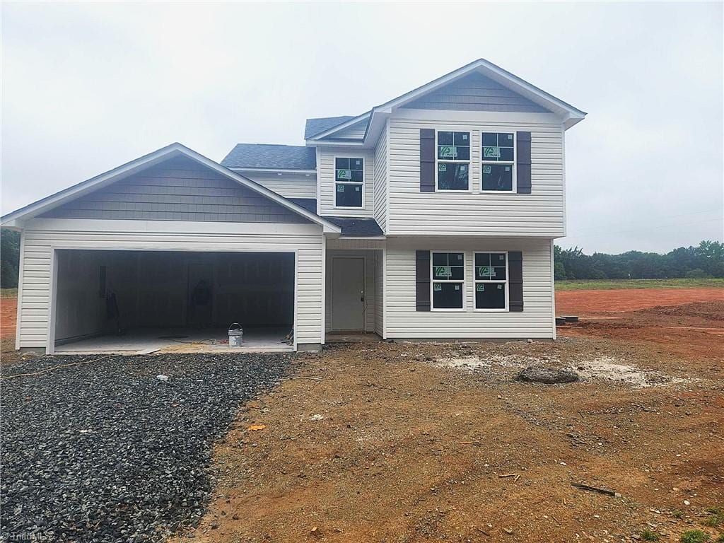 2892 Tysinger Rd, Denton, NC 27239 - view of front of house featuring a garage and gravel driveway