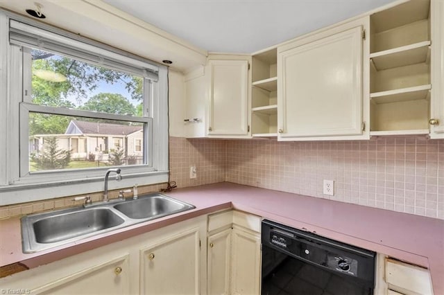 kitchen featuring open shelves, dishwasher, light countertops, a sink, and backsplash
