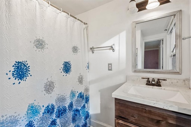 full bathroom with a shower with shower curtain and vanity