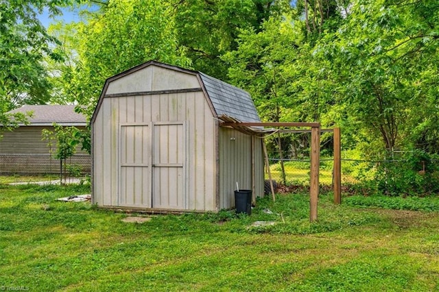 view of shed with fence