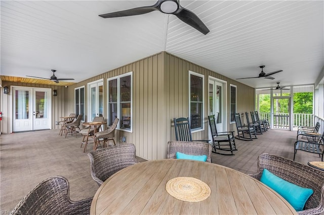 view of patio / terrace with ceiling fan, outdoor dining space, and french doors