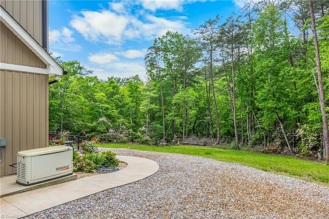 view of yard with a forest view