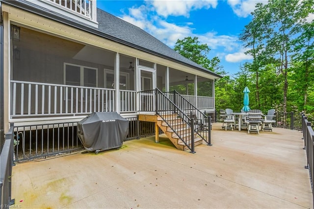 view of patio / terrace with a sunroom, outdoor dining area, grilling area, and ceiling fan