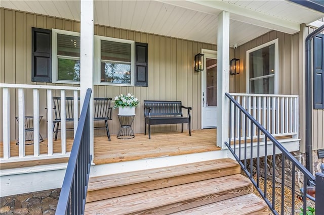 wooden terrace with a porch