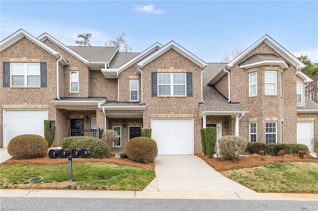 view of front of property with brick siding, an attached garage, concrete driveway, and a shingled roof