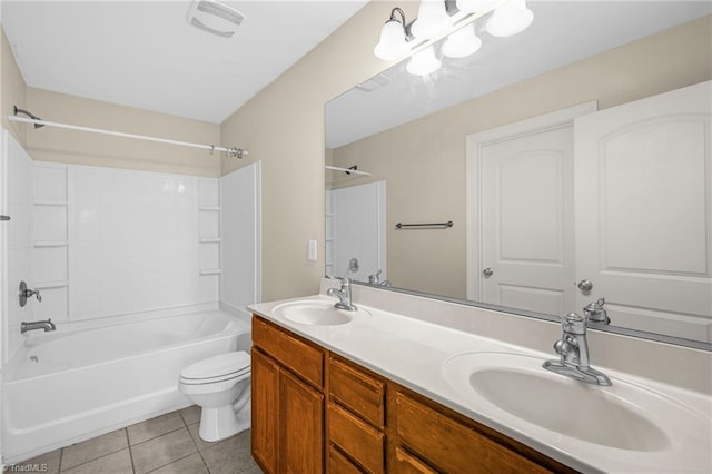 full bathroom featuring tile patterned floors, washtub / shower combination, toilet, and a sink