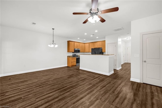 kitchen featuring visible vents, baseboards, appliances with stainless steel finishes, and dark wood finished floors