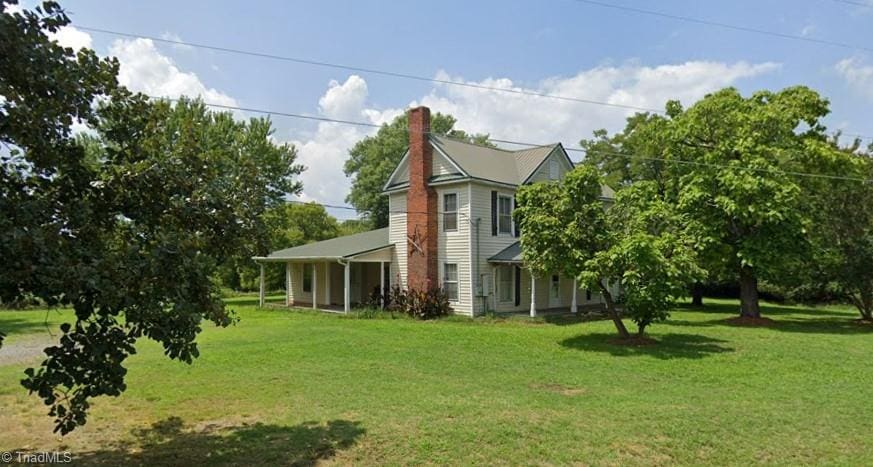 view of home's exterior with a lawn