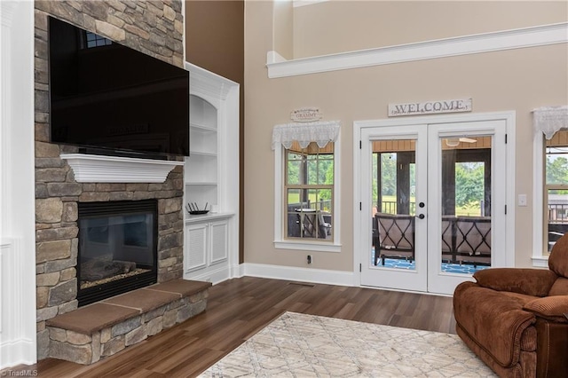 6147 Olde Fields Way, Pfafftown, NC 27040 - living area featuring french doors, wood finished floors, and a fireplace