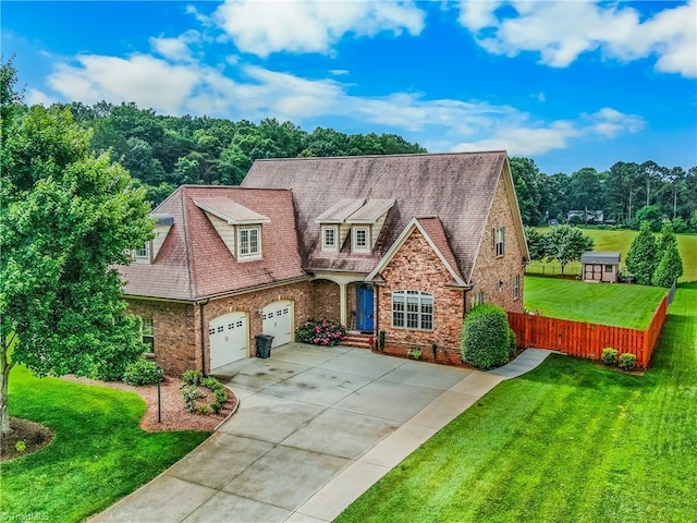 6147 Olde Fields Way, Pfafftown, NC 27040 - view of front of home with brick siding, a garage, concrete driveway, and a shingled roof