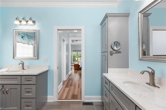 6147 Olde Fields Way, Pfafftown, NC 27040 - full bathroom with ornamental molding, two vanities, and wood finished floors