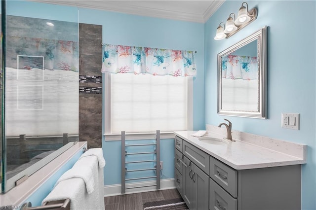 6147 Olde Fields Way, Pfafftown, NC 27040 - bathroom with vanity, ornamental molding, and wood finished floors