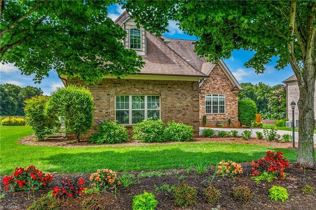 6147 Olde Fields Way, Pfafftown, NC 27040 - view of front of house with a front yard and brick siding