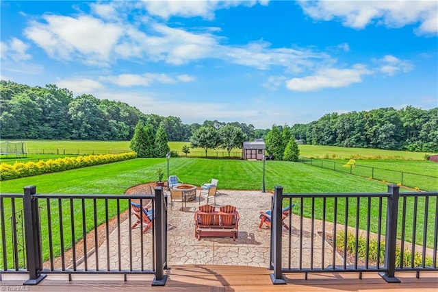 6147 Olde Fields Way, Pfafftown, NC 27040 - view of patio / terrace featuring an outdoor fire pit, a view of rural / pastoral area, and an outbuilding