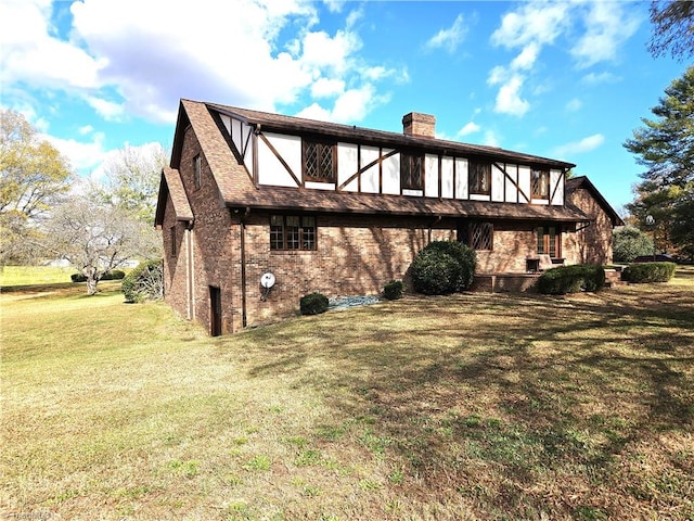 back of property featuring a lawn