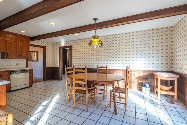 tiled dining space with beam ceiling