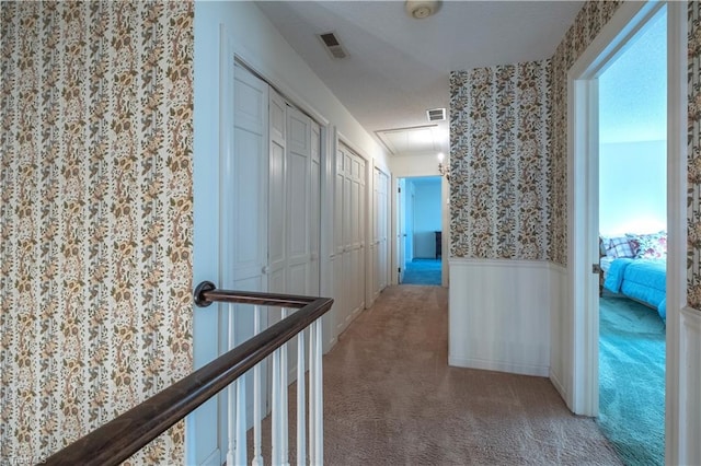 corridor with carpet flooring