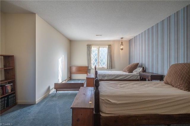 carpeted bedroom with a textured ceiling