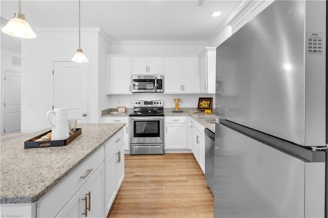 817 Sage Hill Dr, Jamestown, NC 27282 - kitchen with stainless steel appliances, ornamental molding, light wood-type flooring, white cabinetry, and decorative light fixtures