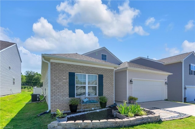 817 Sage Hill Dr, Jamestown, NC 27282 - view of front facade with brick siding, a garage, concrete driveway, a front yard, and a shingled roof
