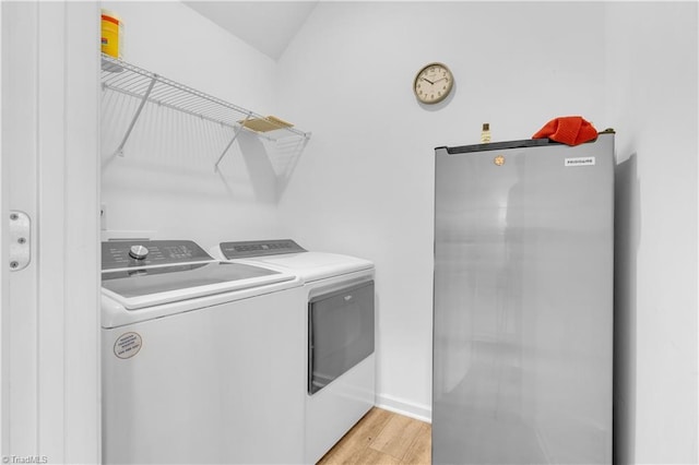 817 Sage Hill Dr, Jamestown, NC 27282 - laundry area featuring washing machine and clothes dryer and light wood-style floors