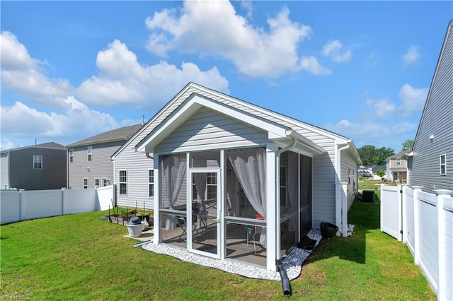 817 Sage Hill Dr, Jamestown, NC 27282 - rear view of house with a sunroom and a fenced backyard