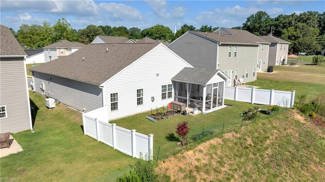 817 Sage Hill Dr, Jamestown, NC 27282 - back of house with a sunroom, a shingled roof, and a fenced backyard