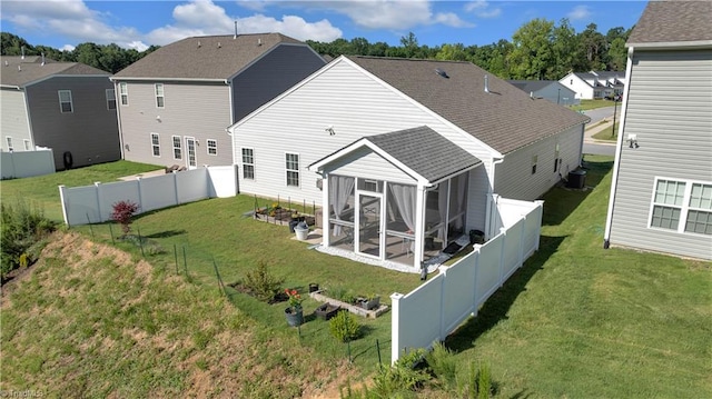 817 Sage Hill Dr, Jamestown, NC 27282 - rear view of house featuring a sunroom, roof with shingles, a fenced backyard, and a residential view