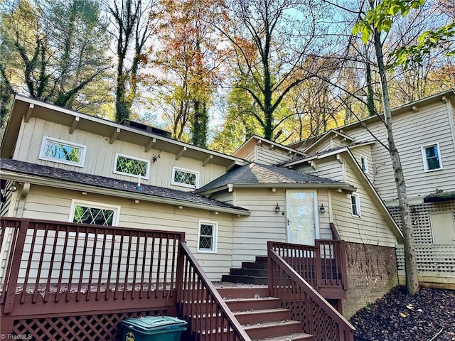 rear view of property with a wooden deck