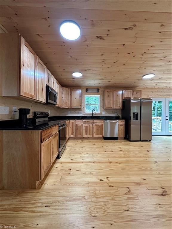 kitchen featuring sink, wood ceiling, stainless steel appliances, and light hardwood / wood-style flooring