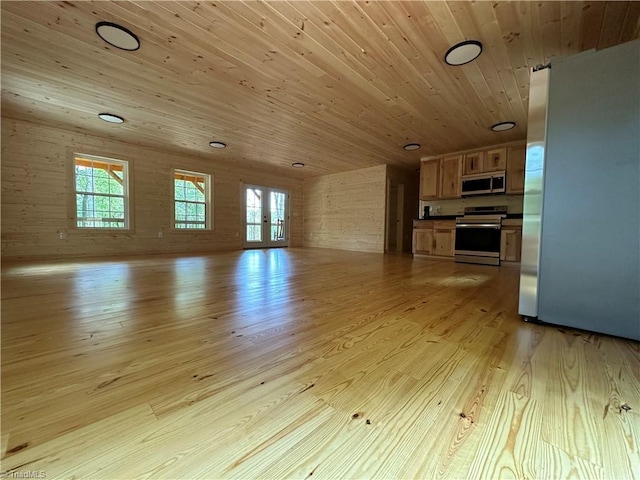 unfurnished living room featuring a wealth of natural light, light hardwood / wood-style flooring, wooden ceiling, and french doors