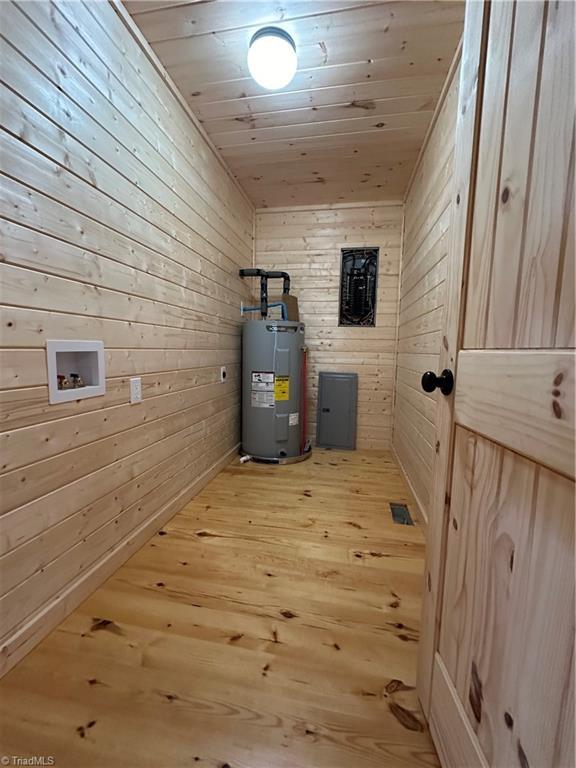 utility room with electric water heater