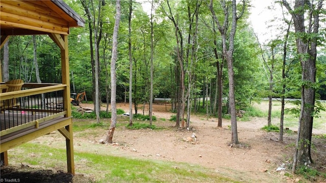 view of yard with a wooden deck